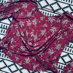 Free People long sleeved patterned maroon top, size large.